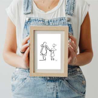 a woman in blue overalls holding a picture frame